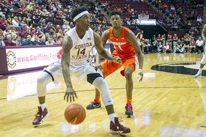 Frank Howard plays defense on a Florida State player on Feb. 11, 2016. 